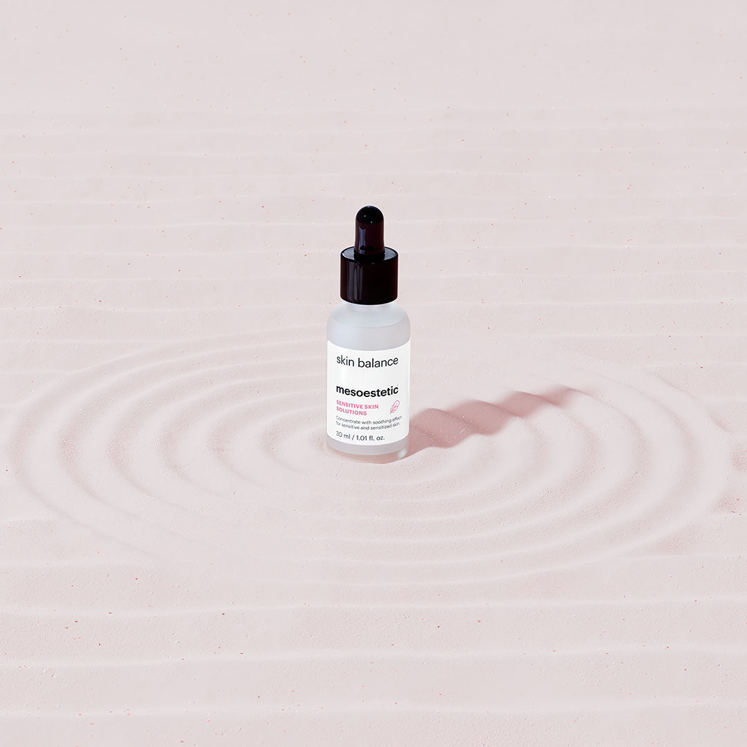 mesoestetic Skin Balance vial on sand